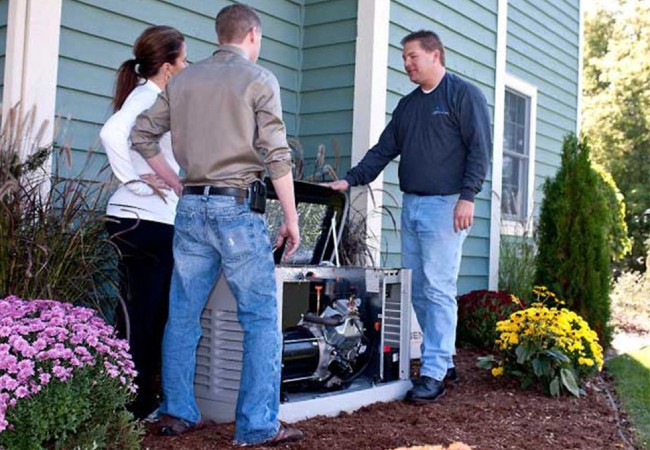 Residential standby generator beside a home