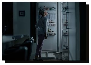 Homeowner checking an electrical panel during a household power outage.