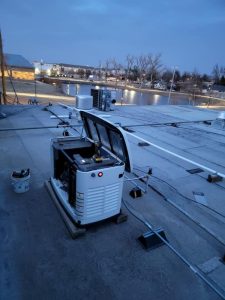 Rooftop HVAC and backup generator equipment installed at a commercial property in Bethany, Oklahoma.