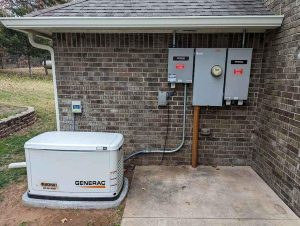 Side view of a professionally installed residential Generac standby generator in Norman, Oklahoma.