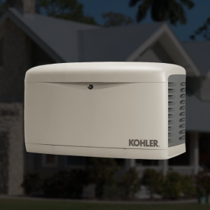 Kohler standby generator installed outdoors beside a residential property.