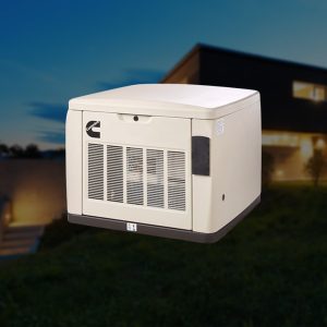 Residential standby generator operating outside a modern home during evening hours.