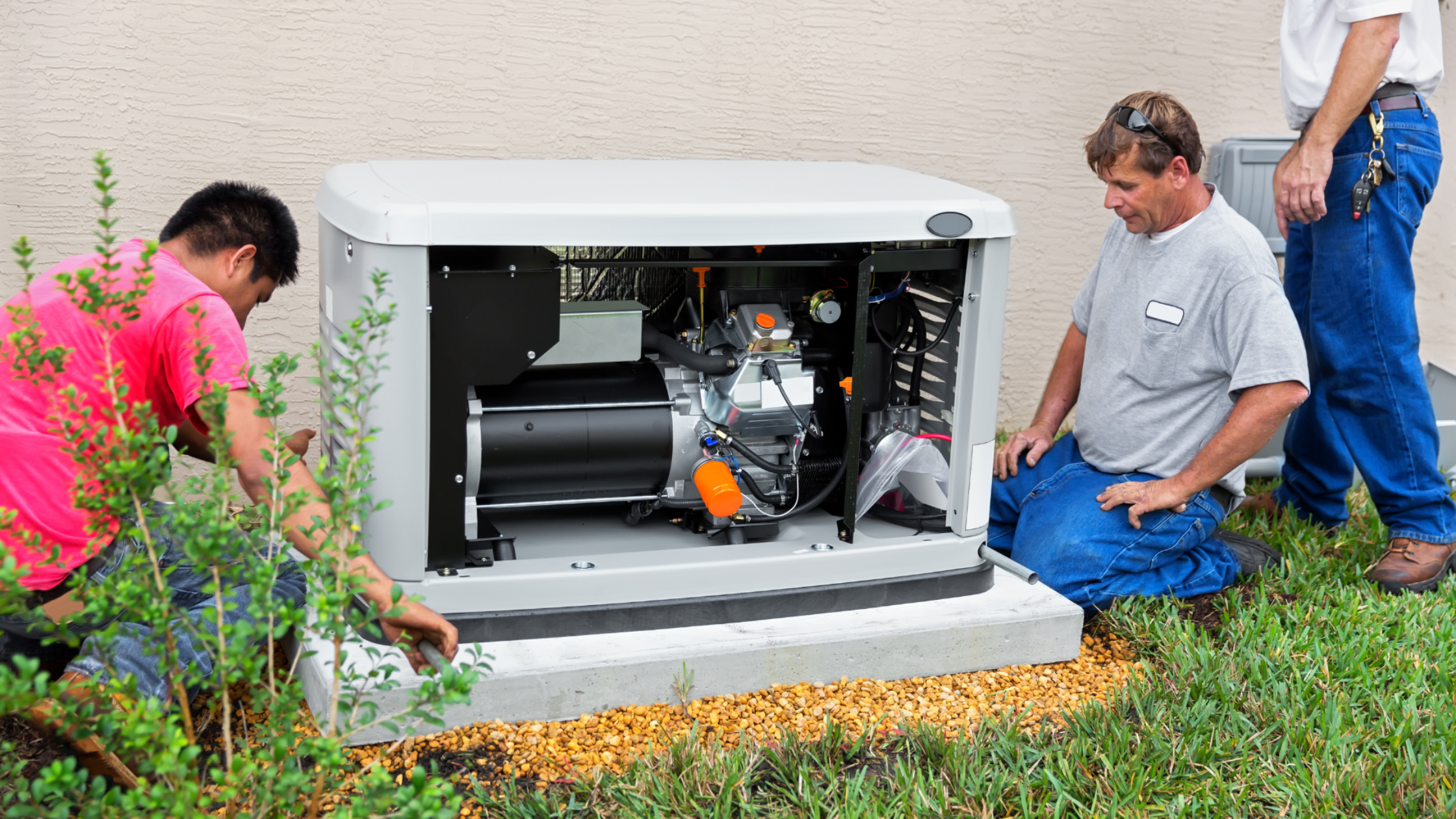 Three technicians installing and inspecting a standby generator outside a home.